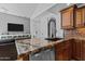 Stylish kitchen featuring granite countertops, stainless steel appliances, and modern cabinetry at 9708 E Via Linda -- # 2328, Scottsdale, AZ 85258