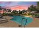 Community swimming pool with lounge chairs and lush trees around the deck at 9708 E Via Linda -- # 2328, Scottsdale, AZ 85258