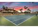 Immaculate community tennis court surrounded by lush greenery and offering a picturesque setting for players at 9708 E Via Linda -- # 2328, Scottsdale, AZ 85258