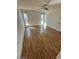 Bedroom featuring sleek wood flooring and bright windows at 9929 W Burns Dr, Sun City, AZ 85351