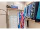 Walk-in closet with built-in shelving, wood rod, and plenty of storage at 10136 E Southern Ave # 1082, Mesa, AZ 85209