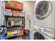 Functional laundry room with washer, dryer, water heater, and shelving units for organized storage solutions at 10136 E Southern Ave # 1082, Mesa, AZ 85209