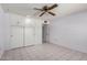 Bedroom featuring a ceiling fan and ample storage with built-in cabinets at 10319 W Twin Oaks Dr, Sun City, AZ 85351