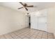 Bedroom featuring a ceiling fan and ample closet space with built-in cabinets at 10319 W Twin Oaks Dr, Sun City, AZ 85351