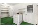 Laundry room featuring vintage washing machine and tiled floors at 10319 W Twin Oaks Dr, Sun City, AZ 85351