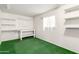 Storage room featuring workbench, pegboard, and built in shelving at 10319 W Twin Oaks Dr, Sun City, AZ 85351