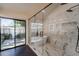 Luxurious bathroom featuring a soaking tub, glass shower, and marble accents at 10360 N 98Th St, Scottsdale, AZ 85258