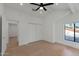 Bedroom featuring light hardwood floors, recessed lighting, and large windows at 10360 N 98Th St, Scottsdale, AZ 85258