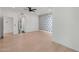 Spacious bedroom featuring a modern ceiling fan and light wood flooring at 10360 N 98Th St, Scottsdale, AZ 85258