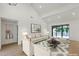 Spacious living room boasting vaulted ceilings and ample natural light from sliding glass doors at 10360 N 98Th St, Scottsdale, AZ 85258