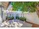 Charming patio area with flower boxes for gardening and shade from mature trees at 10360 N 98Th St, Scottsdale, AZ 85258