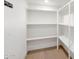 Bright storage area with modern shelving and wood flooring at 10360 N 98Th St, Scottsdale, AZ 85258