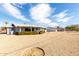 Wide shot of a home and backyard featuring a patio at 10809 W El Dorado Dr, Sun City, AZ 85351