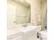 Bright bathroom features a vanity, toilet, and shower-tub combination at 10809 W El Dorado Dr, Sun City, AZ 85351