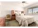 Spacious bedroom featuring built-in headboard and abundant natural light at 10809 W El Dorado Dr, Sun City, AZ 85351