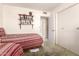 Cozy bedroom featuring twin beds, built-in shelving, and closet at 10809 W El Dorado Dr, Sun City, AZ 85351