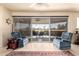 Comfortable living room with expansive views of golf course and outdoor space at 10809 W El Dorado Dr, Sun City, AZ 85351