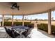 Relaxing covered patio with an outdoor dining area and golf course view at 10809 W El Dorado Dr, Sun City, AZ 85351