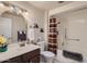 Well-lit bathroom featuring a combination shower and tub with a curtain, a toilet, and a vanity at 10822 W Mimosa Dr, Sun City, AZ 85373