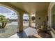 Relaxing covered patio area with comfortable seating and views at 10822 W Mimosa Dr, Sun City, AZ 85373