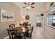 Cozy dining area featuring a ceiling fan, a round table and decorative artwork at 10822 W Mimosa Dr, Sun City, AZ 85373