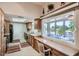 Well-lit kitchen with countertops, views to patio and modern appliances at 10822 W Mimosa Dr, Sun City, AZ 85373