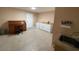 Functional laundry room with desk, cabinets, sink, and ample counter space at 10822 W Mimosa Dr, Sun City, AZ 85373