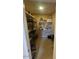 Walk-in pantry with ample shelving for organized storage at 10822 W Mimosa Dr, Sun City, AZ 85373