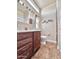 Well-lit bathroom featuring a single sink vanity and a glass enclosed shower at 111 S Greenfield Rd -- # 462, Mesa, AZ 85206