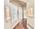 Inviting hallway with wood floors, and recessed shelving with accent lighting at 111 S Greenfield Rd -- # 462, Mesa, AZ 85206