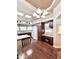 Bright kitchen featuring brown cabinets, white countertops, and a modern chandelier at 111 S Greenfield Rd -- # 462, Mesa, AZ 85206