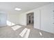 Bedroom features neutral colored carpet and a skylight for natural light at 11223 W Missouri Ave, Youngtown, AZ 85363