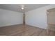 Living room featuring wood flooring, white walls, and ceiling fan at 11223 W Missouri Ave, Youngtown, AZ 85363