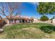 Spacious backyard with a lush lawn, a covered patio, and a tranquil setting at 11445 S 44Th St, Phoenix, AZ 85044