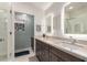 Stylish bathroom featuring double sinks, marble countertops and modern fixtures at 11445 S 44Th St, Phoenix, AZ 85044