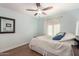 Comfortable bedroom featuring a queen bed and hardwood floors at 11445 S 44Th St, Phoenix, AZ 85044