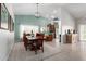 Open concept dining area with light walls, tile floors, and stylish light fixture at 11445 S 44Th St, Phoenix, AZ 85044