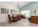 Dining room showcases modern light fixtures, picture window, and decor at 11445 S 44Th St, Phoenix, AZ 85044