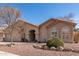 Charming single-story home with manicured desert landscaping and an arched entryway at 11445 S 44Th St, Phoenix, AZ 85044