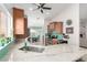 Bright kitchen featuring an island with a marble countertop and a stainless steel sink at 11445 S 44Th St, Phoenix, AZ 85044