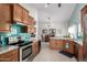 Spacious kitchen featuring stainless steel appliances, stylish cabinetry, and turquoise backsplash at 11445 S 44Th St, Phoenix, AZ 85044