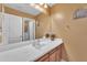 Cozy bathroom featuring a white sink and a decorative mirror, creating a relaxing atmosphere at 11965 W Monte Vista Rd, Avondale, AZ 85392