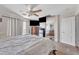 Well-lit bedroom featuring a ceiling fan, balcony and a connecting bathroom, creating a private retreat at 11965 W Monte Vista Rd, Avondale, AZ 85392