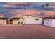 View of home's backyard with seating area and storage shed at 12220 N Escobar Way, Phoenix, AZ 85022