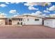 Backyard featuring covered patio, white exterior, and storage shed at 12220 N Escobar Way, Phoenix, AZ 85022