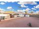 Home's backyard with covered patio and desert landscaping at 12220 N Escobar Way, Phoenix, AZ 85022