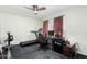 Bright bedroom featuring a treadmill, desk, and ceiling fan at 12220 N Escobar Way, Phoenix, AZ 85022