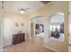 Welcoming entryway showcasing neutral walls and tile, flowing into the living room at 127 S Hancock Trl, Casa Grande, AZ 85194