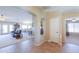 Inviting foyer with tile flooring, open floor plan, and views to the living and dining spaces at 127 S Hancock Trl, Casa Grande, AZ 85194