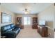 Office featuring carpet flooring, a ceiling fan, and built-in bookshelves at 127 S Hancock Trl, Casa Grande, AZ 85194